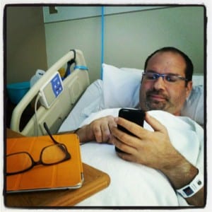 Photo of David Esrati in VA hospital bed recovering from kidney stone removal surgery