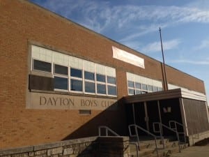 photo of Dayton Boys Club, East side, with banner of yet another charter school