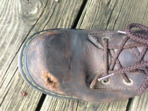 Photo of Doc Marten shoe after motorcycle accident. No damage to foot- just to the shoe