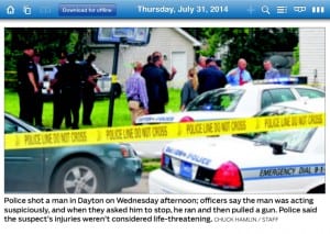 Crime scene photo in Dayton Daily news with Esrati net and sticker in background